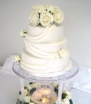 fountain wedding cake- drapes and roses