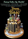Ofoma birthday cake gold drip over black choc buttercream plus vodka bottles - 1.jpg
